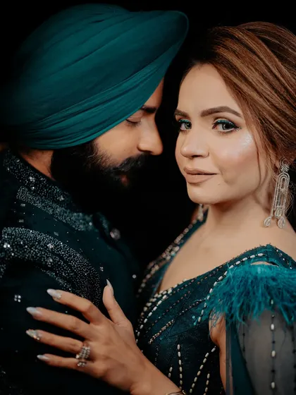 For your sagan or cocktail night, we can create a look that's pure glamour. Here, I've used a smokey eye and sculpted features to complement the couple's coordinated deep teal outfits. It’s all about creating that perfect, romantic, and high-fashion vibe for your special evening.