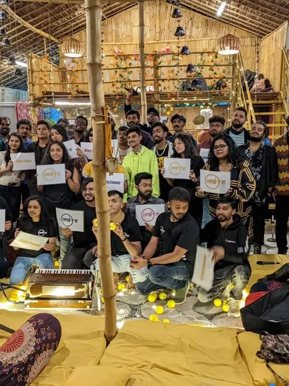 A group photo with all the artists at an acoustic music event. This shows my involvement in the local music community and my passion for intimate, live performances.
