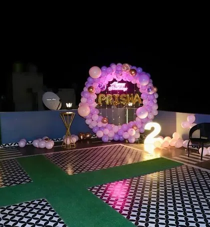 A wider view of the terrace setup, showing the decorated floor and the overall ambiance.