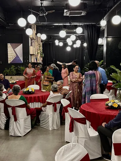 Guests mingling at a corporate or family gathering, showcasing the indoor dining and social space we offer.