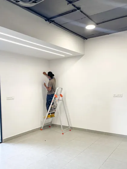 The first line on a blank wall is always a special moment. This is the very start of a project, where the entire space is a canvas waiting for a story to be told.