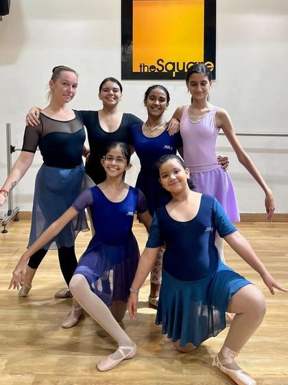 A group photo celebrating our student Ira Naik's acceptance into the Royal Ballet School summer program. This is a testament to her hard work and our school's training.