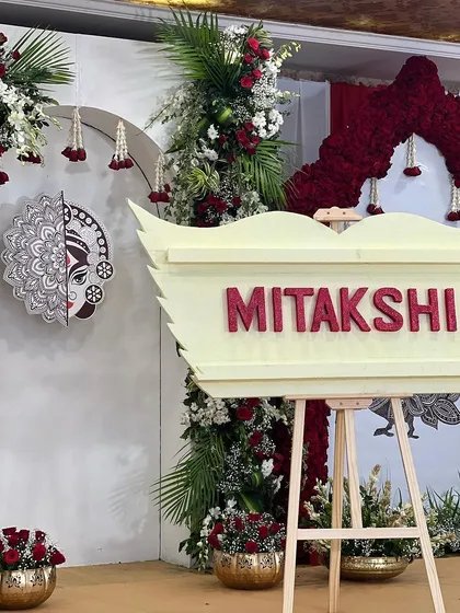 The name reveal is a pivotal moment. I designed this custom 'Mitakshi' nameplate, which was unveiled during the ceremony, tying back to the overall theme.