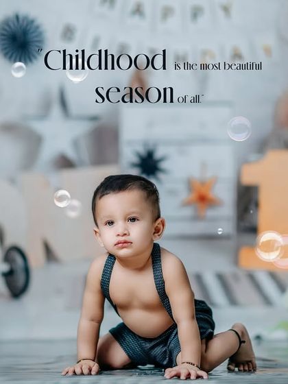 Childhood is the most beautiful season of all. A candid moment from a first birthday studio session, complete with bubbles and balloons.