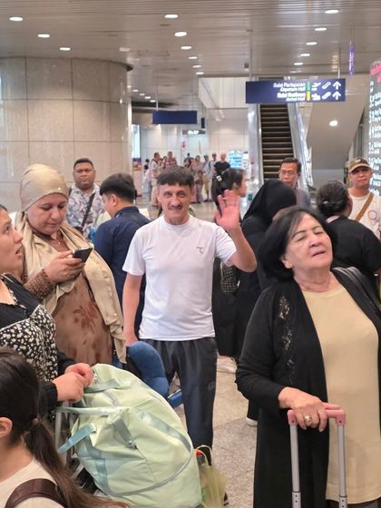 A candid moment at the airport with other teams. Traveling for competitions helps our students build friendships with martial artists from around the world.