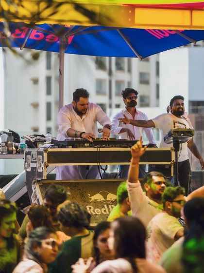 Behind the decks at a rooftop Holi party. I love the challenge of reading a diverse crowd and playing the perfect tracks to keep them moving.