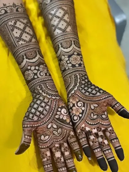 This full-arm design is filled with beautiful floral and geometric patterns, perfect for a bride who wants a rich and detailed look.
