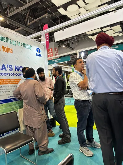 A group of visitors gathers to learn about solar subsidy benefits at our stall. We ensure everyone understands the financial advantages of switching to a solar rooftop system.