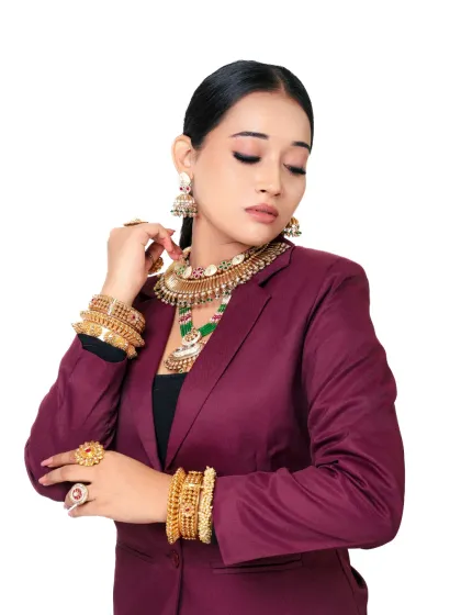 A full-body shot of the fusion look, showing how the heavy bracelets and rings complement the modern blazer. It's a statement of power and style.