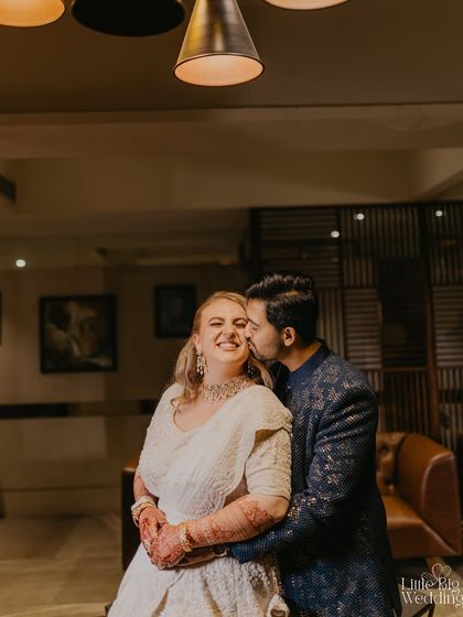 A sweet kiss on the cheek. These are the tender, unscripted moments we look for amidst the energy of a Sangeet night.