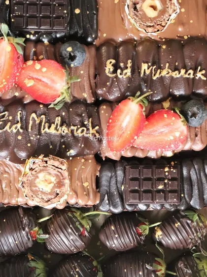 Another detailed shot of the decadent Eid chocolate cake, showing the mix of textures from fresh fruit and chocolate pieces.