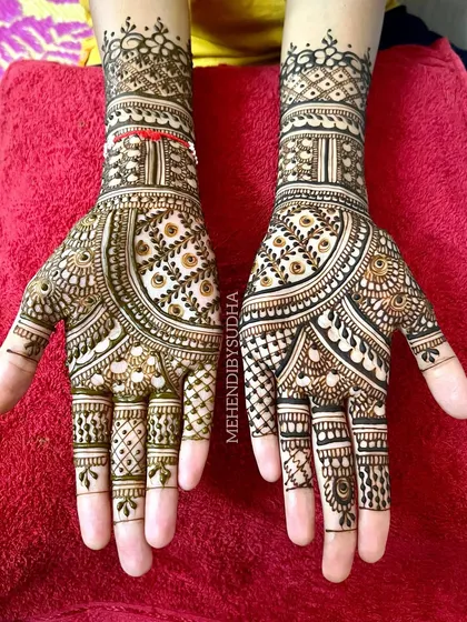 An elegant design for a family member, featuring a mix of traditional Indian patterns and geometric fillers.