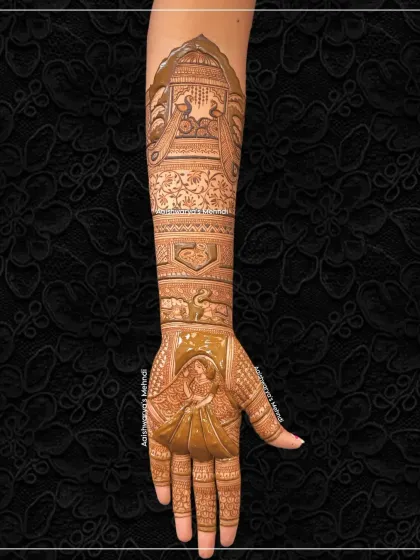 This full-arm bridal design features a beautiful bride figure on the palm and two peacocks on the arm. The combination of figures and traditional motifs creates a balanced and stunning look.