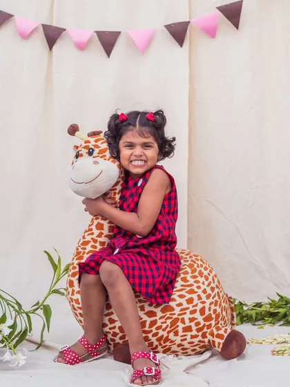 A perfect playdate outfit. This red and blue checkered dress is made from breathable cotton and has a simple, comfortable design for hours of fun.