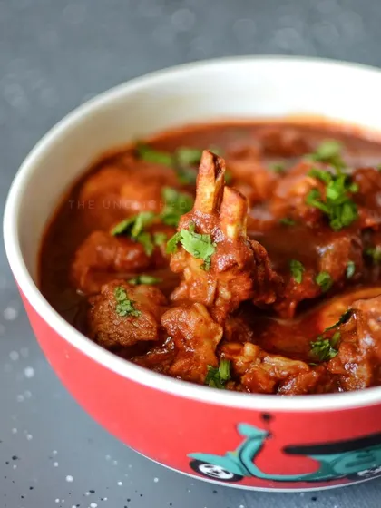 A close-up of our signature Rogan Josh. We take pride in our culinary craftsmanship, preparing authentic dishes like this slow-cooked lamb curry with rich, aromatic spices.