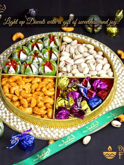 This is the essence of festive gifting. Our signature round tray is artfully divided to hold an assortment of premium roasted cashews and pistachios, decadent handmade chocolates, and traditional Indian sweets, all tied together with our branded ribbon.