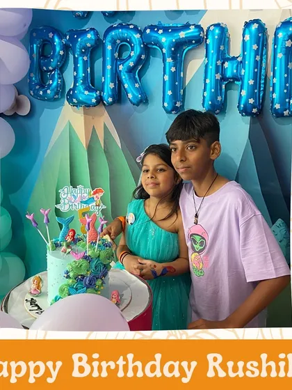 Happy Birthday, Rushika. The birthday girl poses with her brother next to her beautiful Ariel-themed cake.