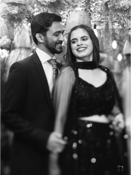 A soft-focus black and white shot of the couple, creating a dreamy and romantic feel.