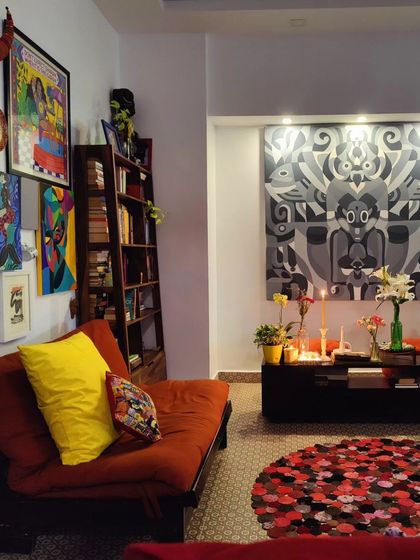 Another corner of my studio, showcasing a collection of personal art, a comfortable futon, and a handmade rug.