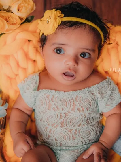 The look of surprise and curiosity on a baby's face is priceless. This is what milestone photography is all about.