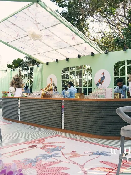 The custom-built bar at 'The Conservatory' baby shower, a central hub for guests to gather and celebrate.
