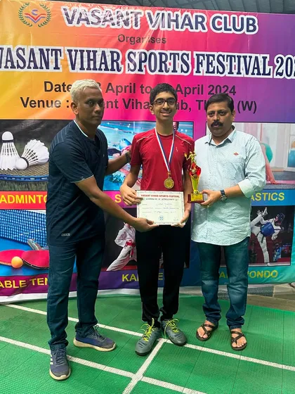 Boys U-15 winner Sarthak Khadilkar receiving his trophy at the Vasant Vihar Sports Festival.