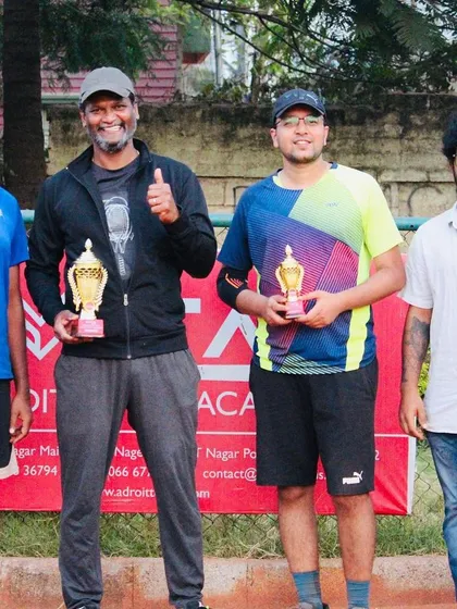 The thrill of the final point. Here are the winner and finalist from a hard-fought Just-Am singles title match, showcasing the competitive spirit of our amateur tennis championship.