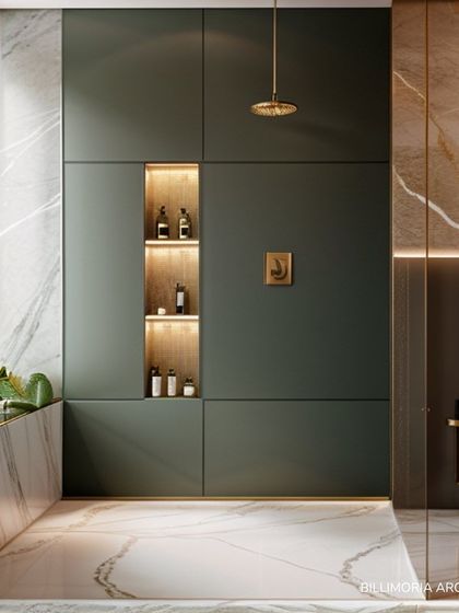 Clean lines and smart storage define this bathroom design. The floor-to-ceiling cabinets in a muted green are paired with marble walls and a built-in planter, seamlessly blending functionality with a nature-inspired aesthetic.