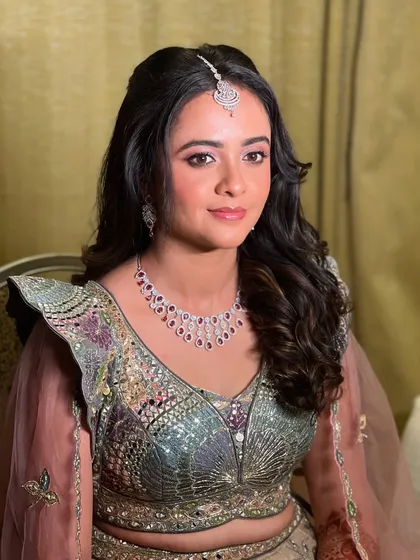 A beautiful Sangeet look for my bride Neha, featuring soft pink eye makeup and a diamond maang tikka.