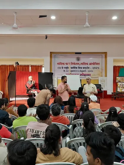 Interacting with the audience and answering questions during the portrait demonstration in Nashik. I believe teaching is as important as creating.