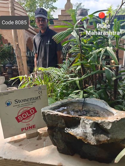 One of our team members stands with the sold rock fountain, a moment of pride before it's sent to its new owner in Pune.
