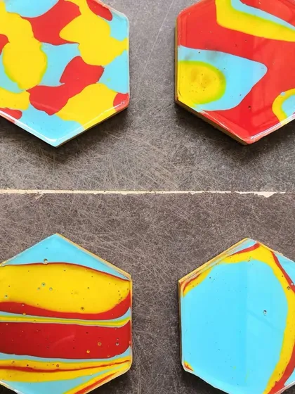 Art can be functional too. I create these handmade concrete coasters, each with a unique, miniature acrylic pour. They are a great way to bring a pop of color and abstract art to your daily life. You can get a matching set or mix them up for a more eclectic look.
