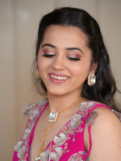 A happy smile completes this romantic look. The shimmering eyeshadow catches the light beautifully, adding a touch of glam.