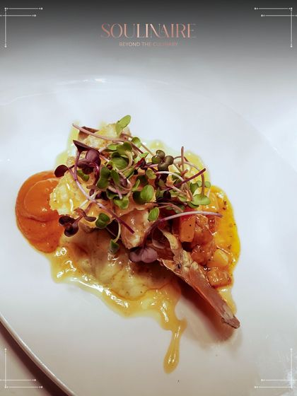 A stunningly plated lamb chop, garnished with microgreens and a rich sauce. This dish is a testament to the remarkable culinary excellence we bring to every event.