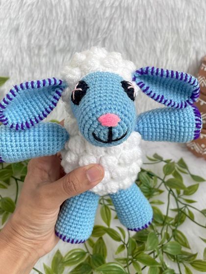 This cute blue sheep is from the popular kids' show Cocomelon. The bobble stitch gives it a fluffy texture, and the bright colors make it a perfect toy for little ones.