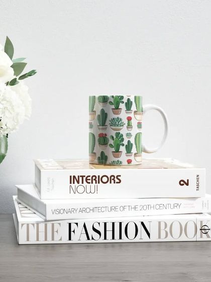 A cute and trendy cactus-themed mug, perfect for a plant lover. It adds a touch of quirky fun to a morning coffee routine.