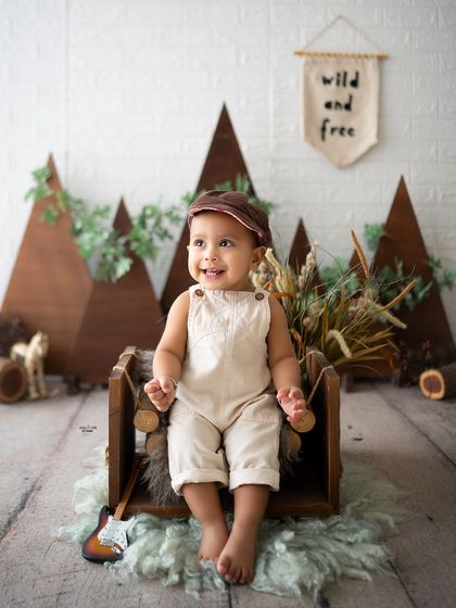 A sweet portrait of this little adventurer in his rustic, mountain-themed setup.