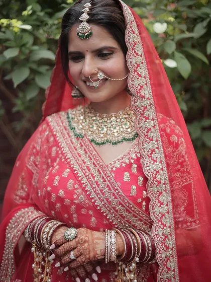 A close-up shot showing the delicate details of the makeup and the bride's joyful expression. Her request for a minimal look was honored, focusing on enhancing her natural beauty.