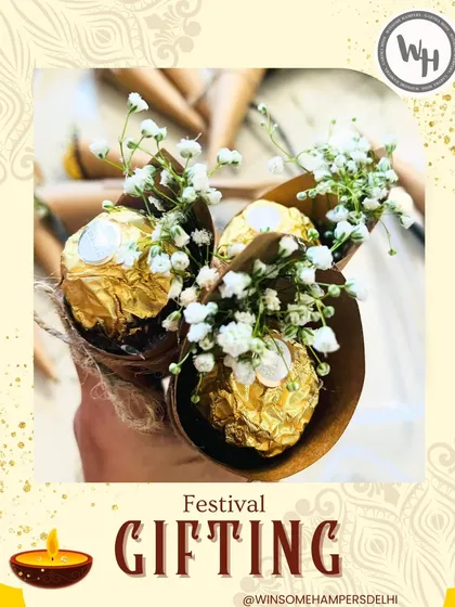 A close-up of my handcrafted confetti cones, an elegant and affordable party favor. Each cone holds a golden Ferrero Rocher chocolate nestled amongst delicate baby's breath flowers, perfect for weddings, showers, or corporate events.