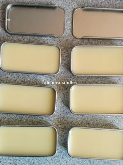 A batch of solid perfumes in rectangular slider tins, ready for labeling. This shows my capacity for bulk production.