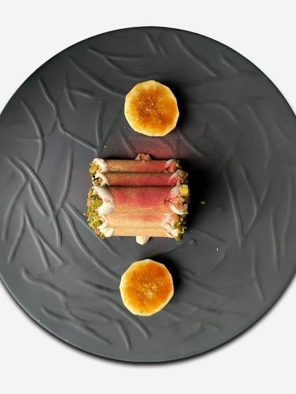 An overhead view of the mishti doi cannoli, a creative fusion of Italian pastry and Bengali sweet, showcasing our playful approach to dessert.