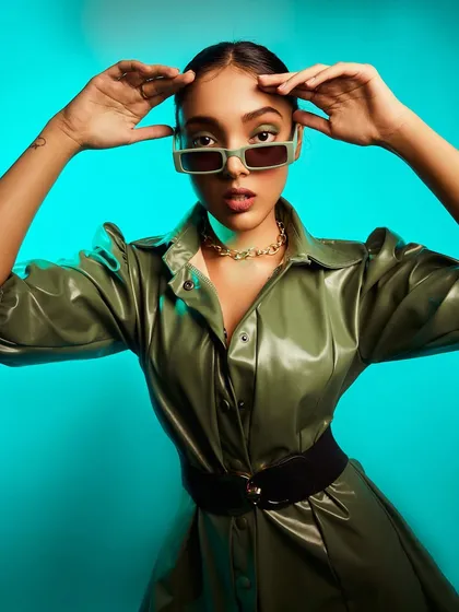 This shot captures the confidence and attitude this outfit inspires. The pose and expression perfectly match the bold, high-fashion vibe of the look.