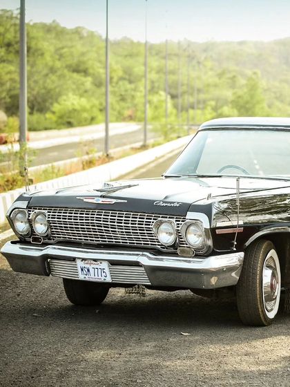 Sometimes the prop is a star in its own right. We use unique elements like this vintage Chevrolet to set a specific mood and theme for your pre-wedding photoshoot.