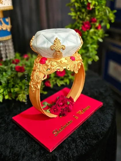 A unique and elegant engagement cake sculpted to look like a giant diamond ring. This is one of my favorite gravity-defying designs, perfect for making a bold statement at your celebration.