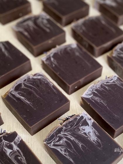 A collection of our Purple Rain bars, each with a unique swirl pattern. This soap is part of our essentials collection, designed for everyday luxury and gentle skin nourishment.