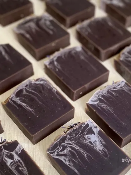 A collection of our Purple Rain bars, each with a unique swirl pattern. This soap is part of our essentials collection, designed for everyday luxury and gentle skin nourishment.