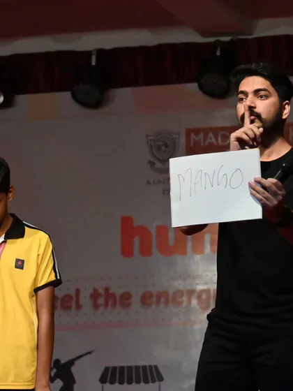The final reveal. After a student participant silently thinks of an object, I show my written prediction to the audience, confirming that I knew he was thinking of a mango all along.