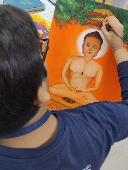 A series documenting a student's creation of a Jain spiritual painting, showing the careful application of color and detail.