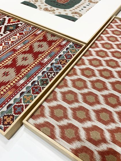 A collection of framed rug sections, showcasing different patterns and textures. This approach allows you to create a gallery wall of textiles, turning smaller pieces into a cohesive and sophisticated display.