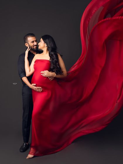 Another example of a romantic couple's pose with the dramatic red fabric. We'll practice different ways to involve partners in these creative shots.